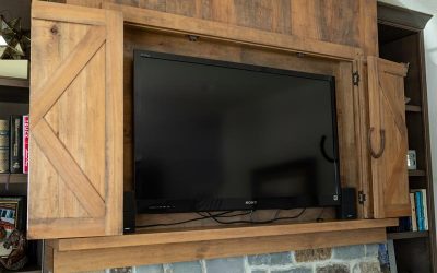 Custom Rustic TV Cabinet above Fireplace - open doors