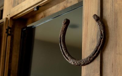 Custom Rustic TV Cabinet above Fireplace - open horse shoe door latch