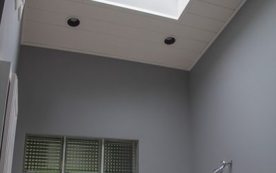 White Custom Shelve and Shiplap Ceiling in Bathroom - Skylight