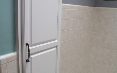 White Custom Storage Cabinet in Checkerboard Bathroom